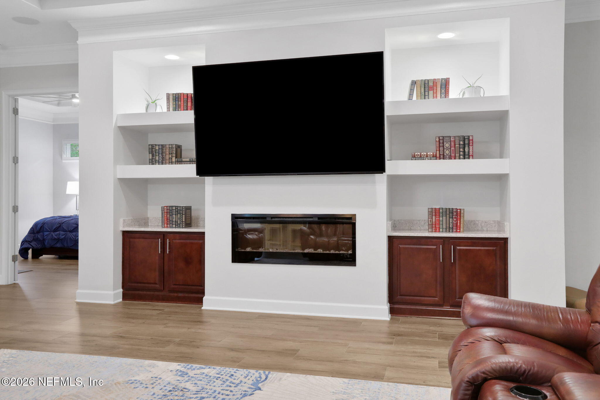 4460 Barkoskie Road Jacksonville, FL 32258 - Photo 26 of 80 a living room with furniture and a flat screen tv