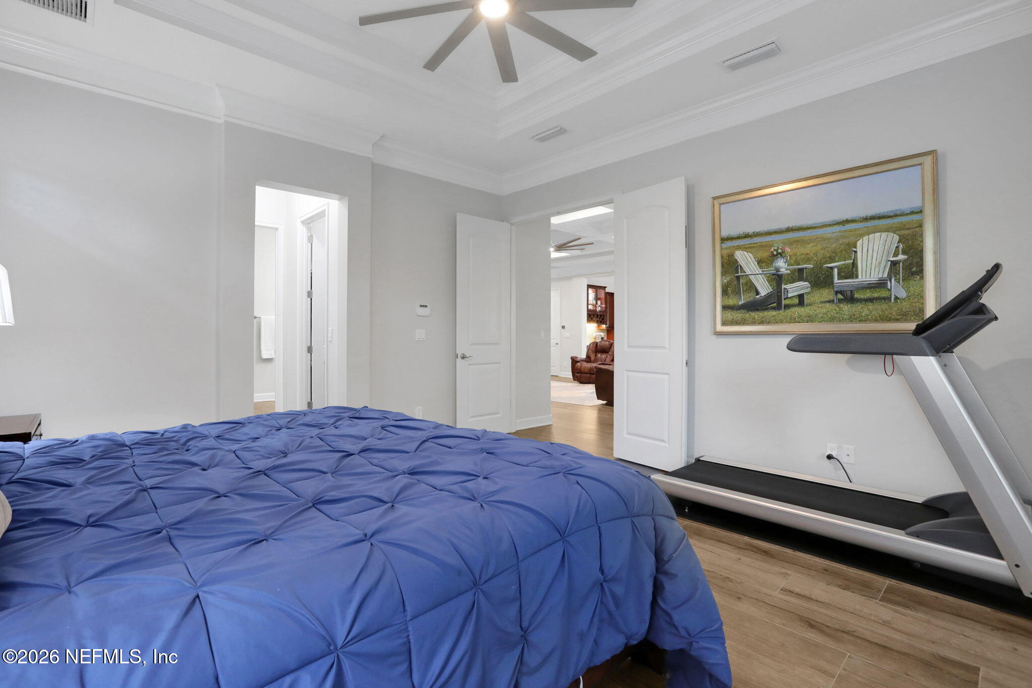 4460 Barkoskie Road Jacksonville, FL 32258 - Photo 29 of 80 a bedroom with a bed and a painting on the wall