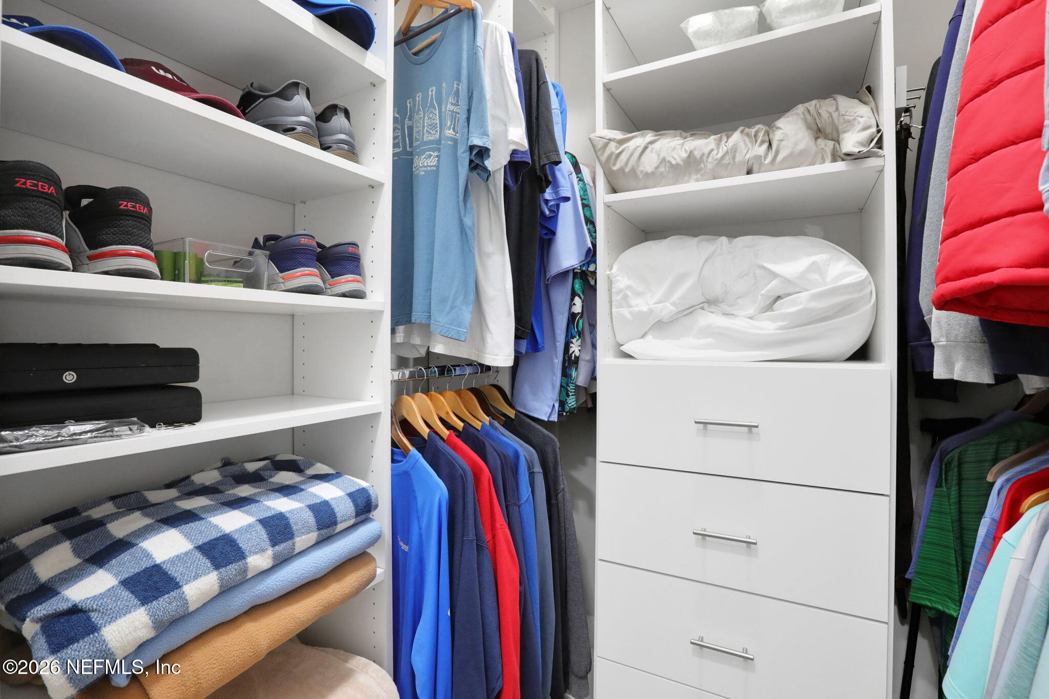 4460 Barkoskie Road Jacksonville, FL 32258 - Photo 31 of 80 a view of walk in closet with clothes and shoes