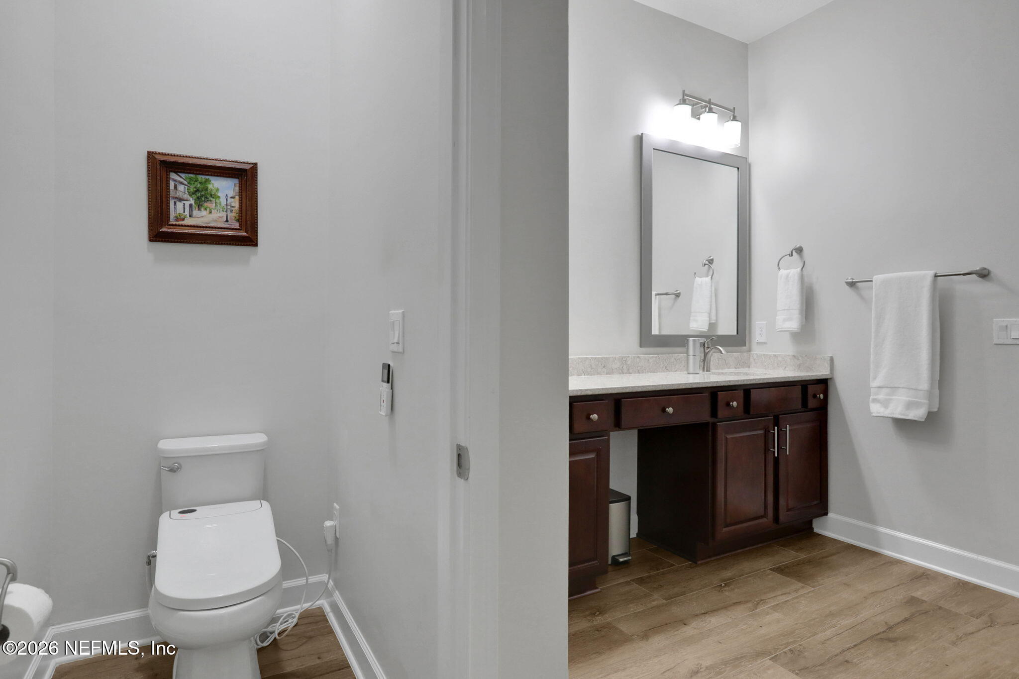 4460 Barkoskie Road Jacksonville, FL 32258 - Photo 36 of 80 a bathroom with a toilet sink and mirror