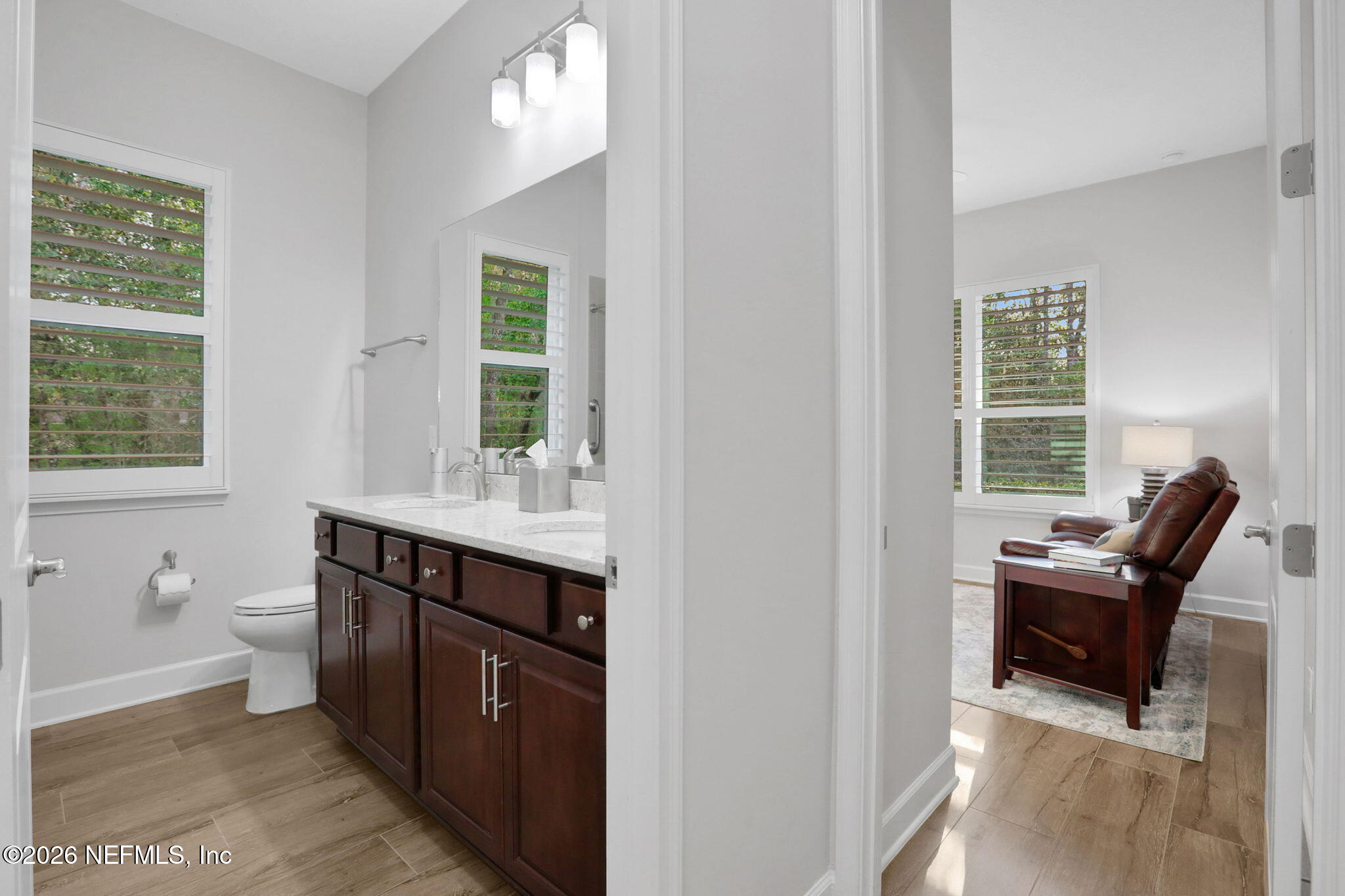 4460 Barkoskie Road Jacksonville, FL 32258 - Photo 43 of 80 a spacious bathroom with a toilet sink and mirror