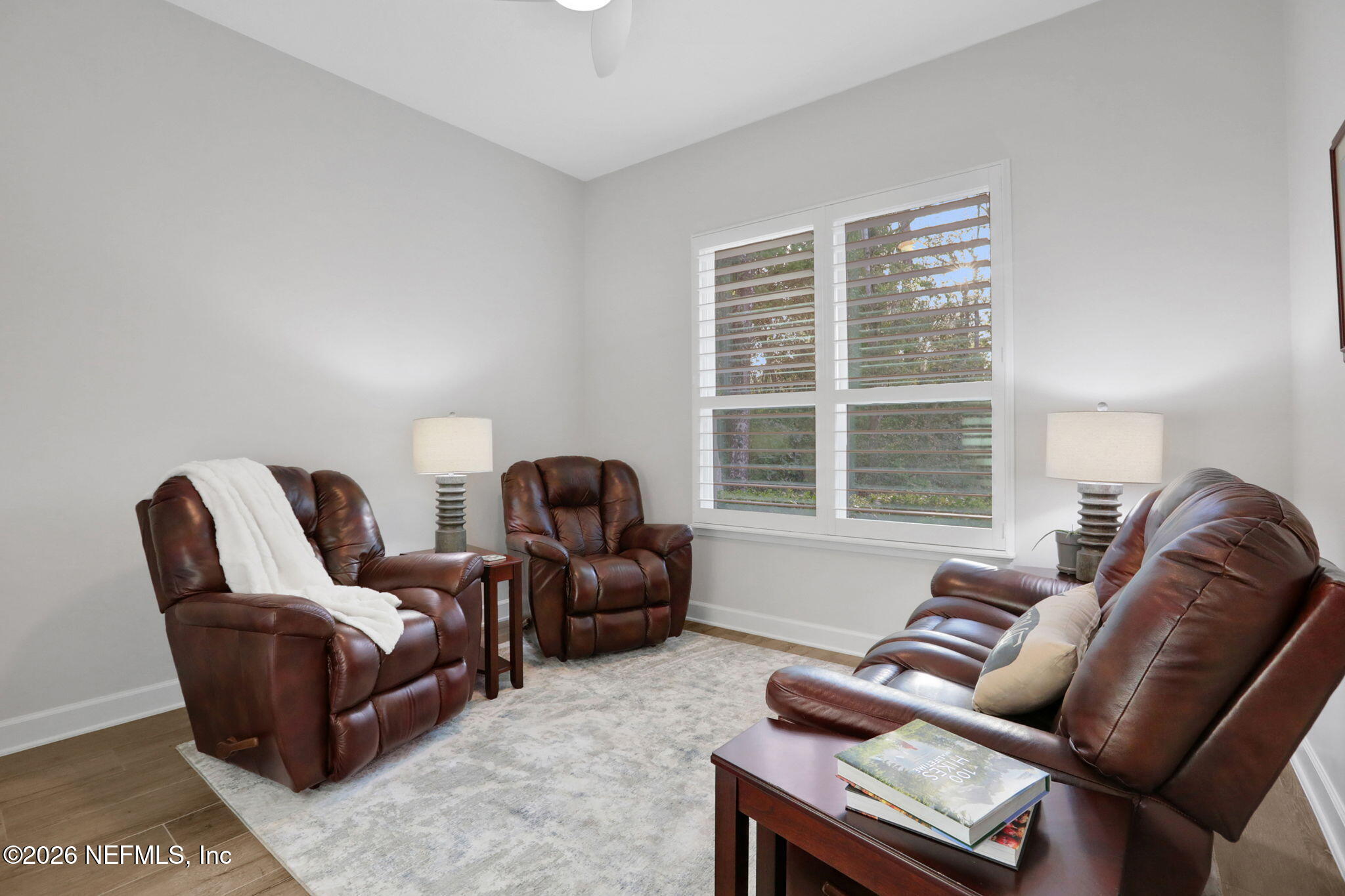 4460 Barkoskie Road Jacksonville, FL 32258 - Photo 44 of 80 a living room with furniture and a large window