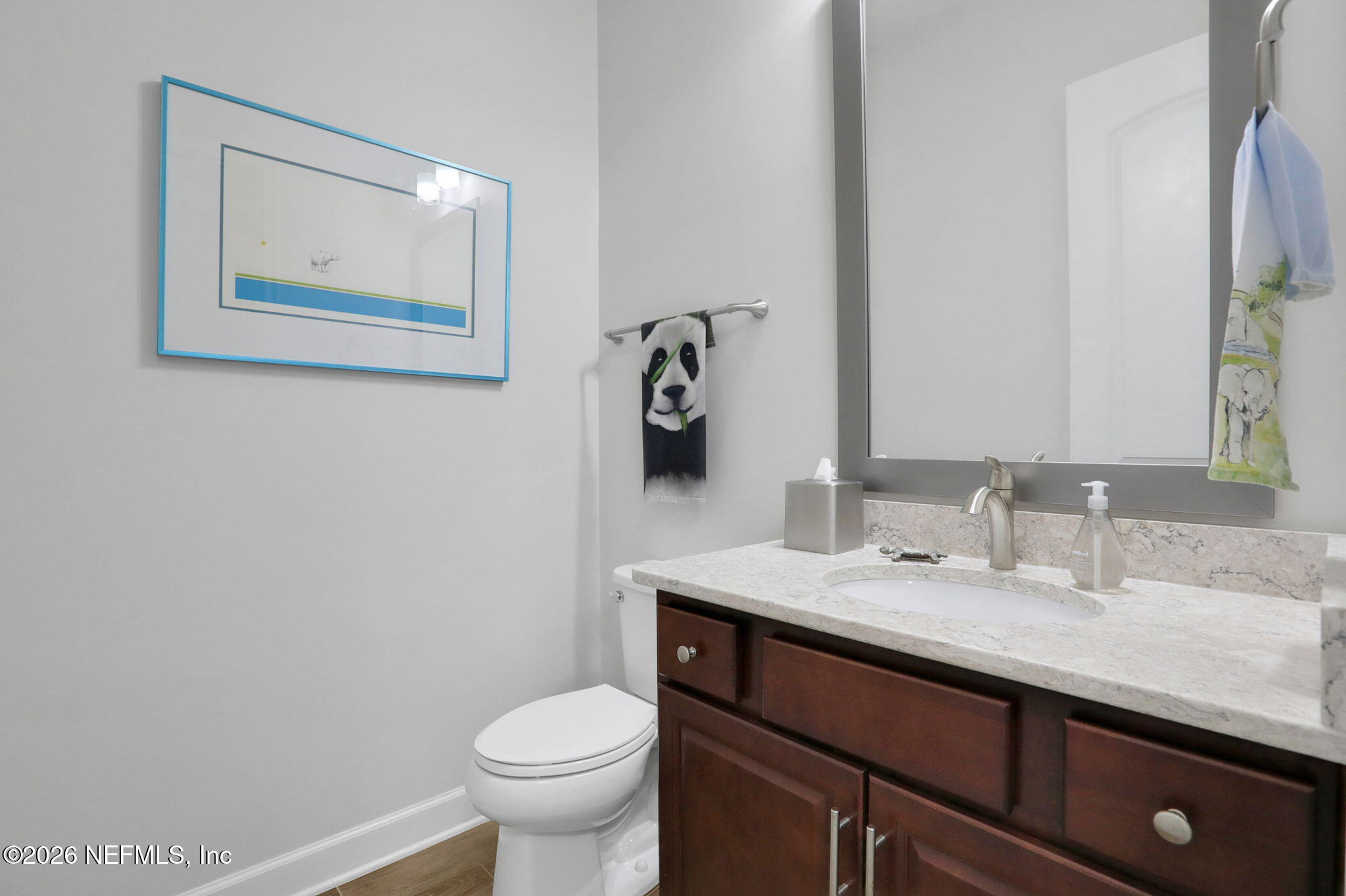 4460 Barkoskie Road Jacksonville, FL 32258 - Photo 47 of 80 a bathroom with a granite countertop toilet sink and mirror