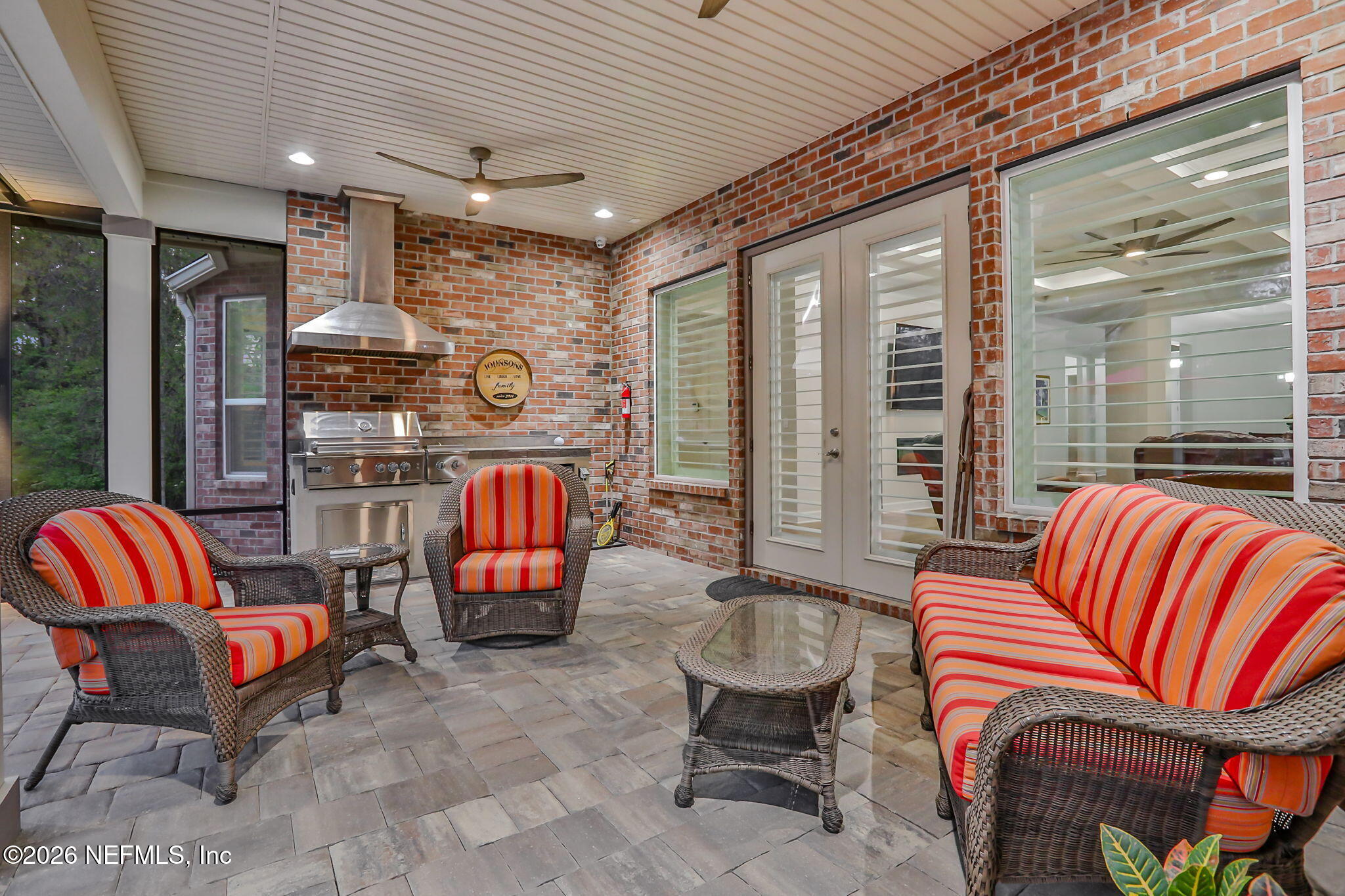 4460 Barkoskie Road Jacksonville, FL 32258 - Photo 51 of 80 a outdoor living space with patio furniture and a potted plant