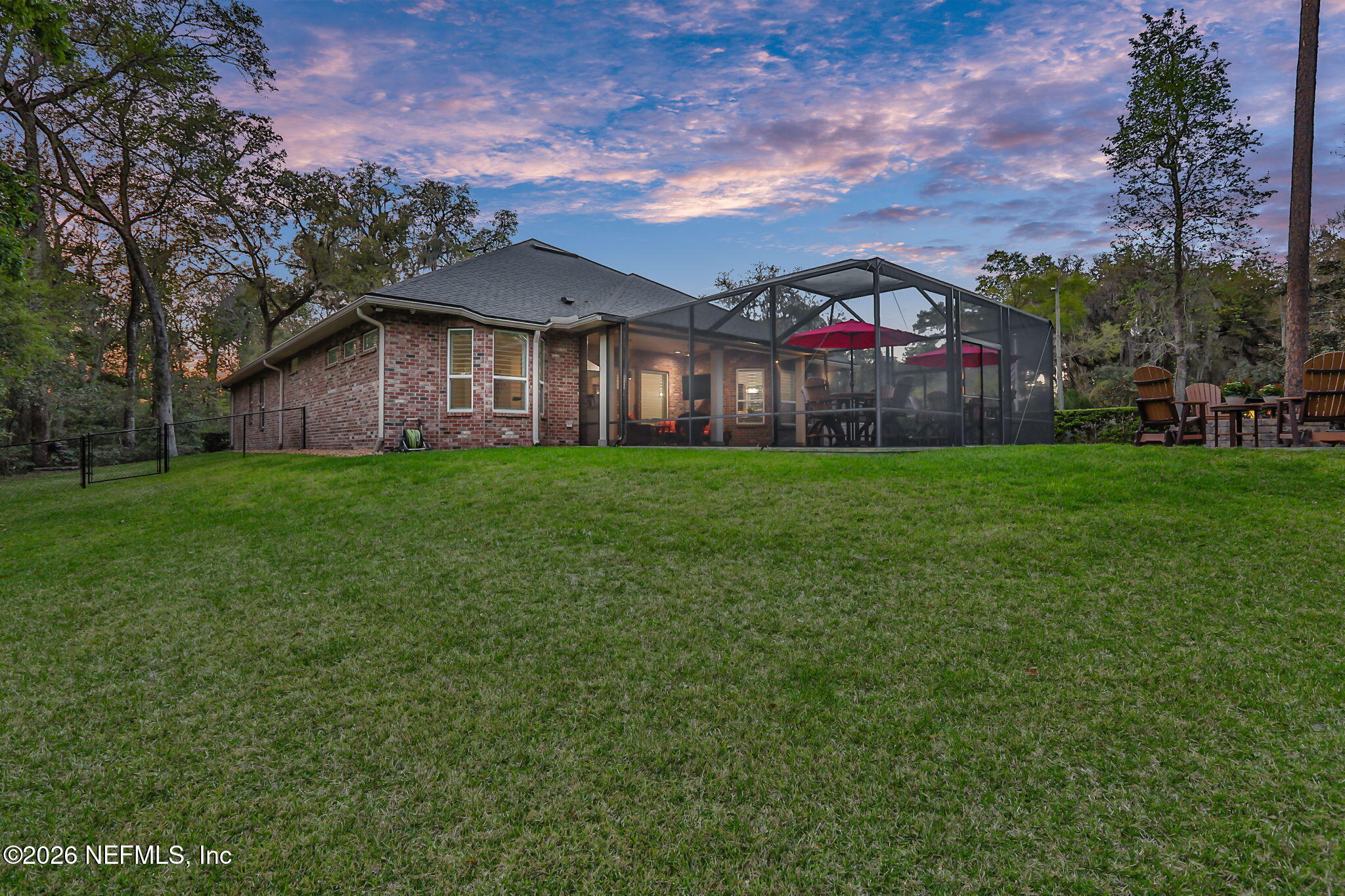 4460 Barkoskie Road Jacksonville, FL 32258 - Photo 58 of 80 a view of a big house with a big yard and large trees