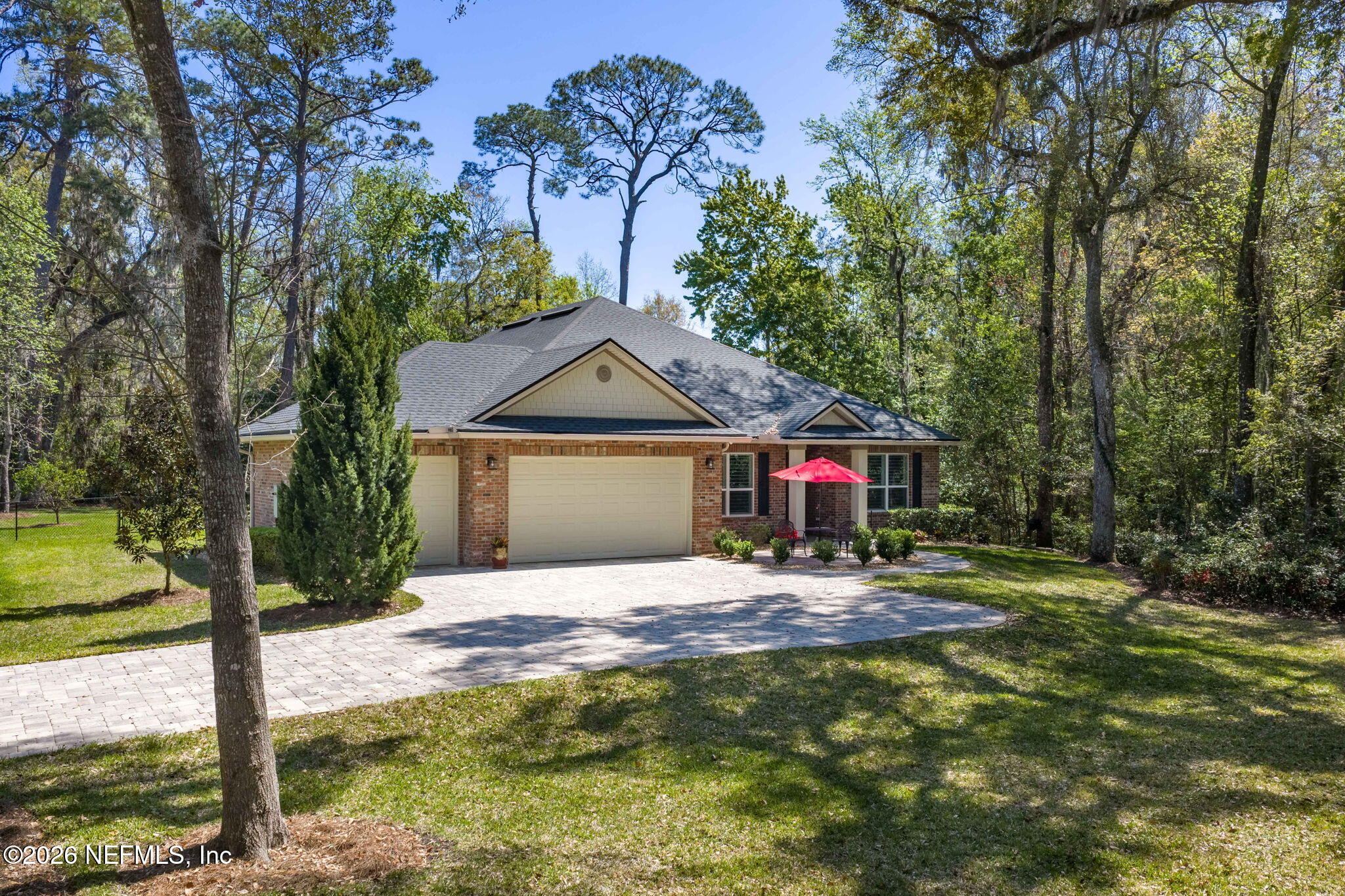 4460 Barkoskie Road Jacksonville, FL 32258 - Photo 63 of 80 a front view of a house with a yard and trees