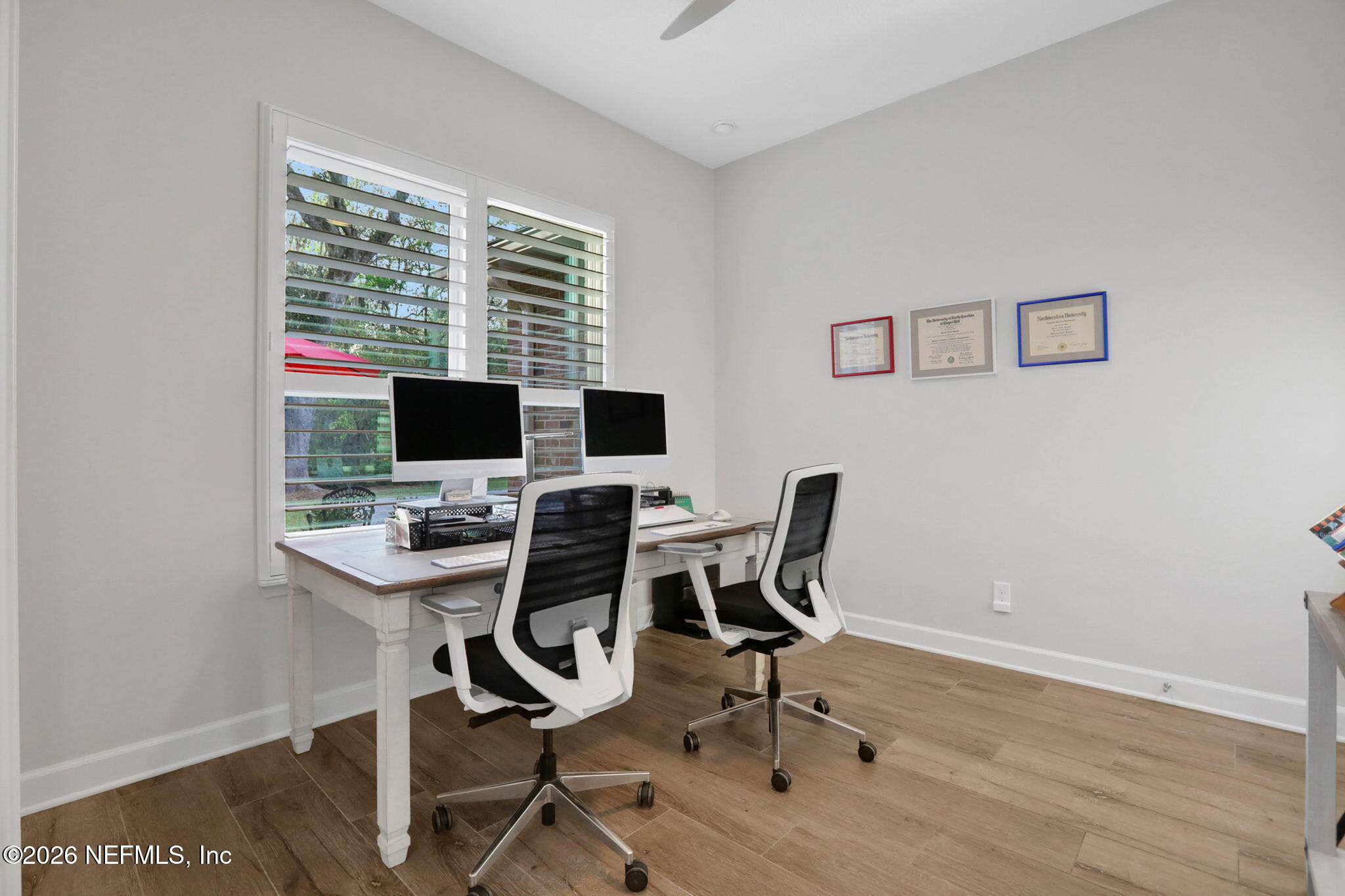 4460 Barkoskie Road Jacksonville, FL 32258 - Photo 10 of 80 a view of a workspace with furniture and a window