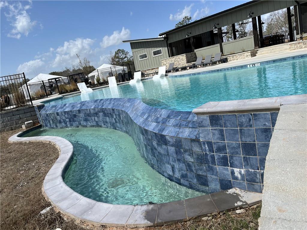 123 Blalock Mountain Road Talking Rock, GA 30175 - Photo 28 of 35 a view of swimming pool with a yard