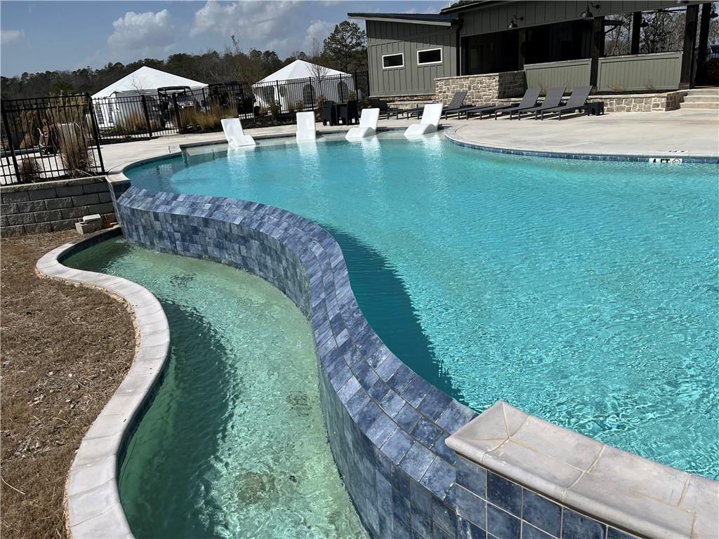 123 Blalock Mountain Road Talking Rock, GA 30175 - Photo 30 of 35 a swimming pool with outdoor seating and yard