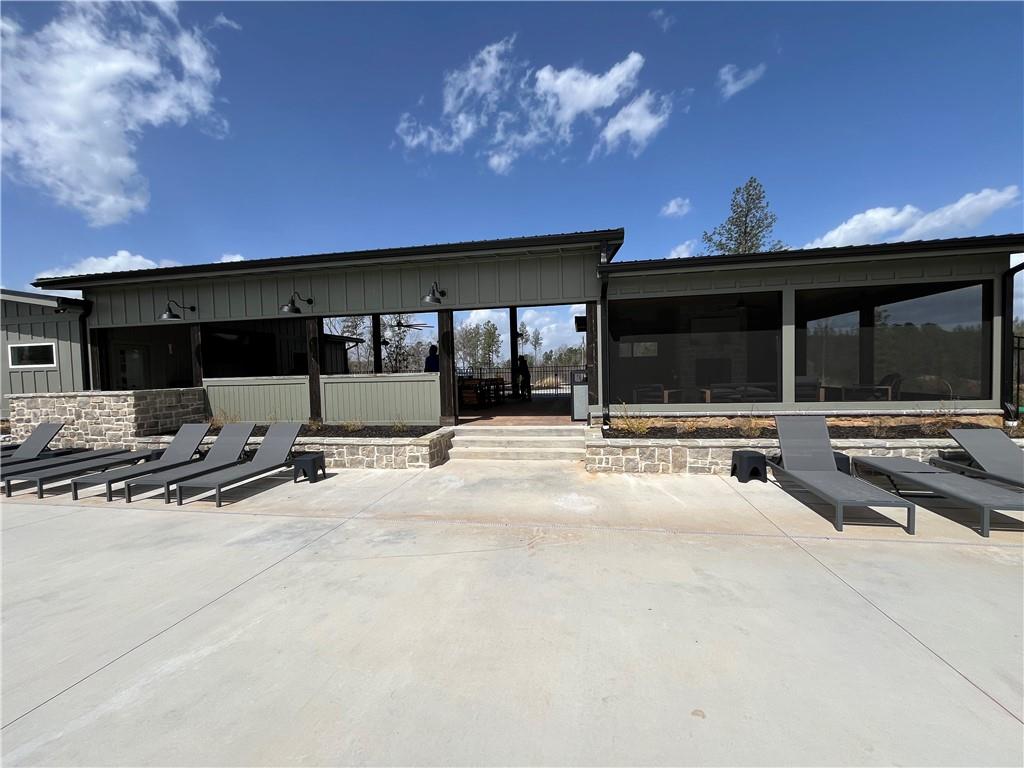 123 Blalock Mountain Road Talking Rock, GA 30175 - Photo 34 of 35 a swimming pool with outdoor seating and yard