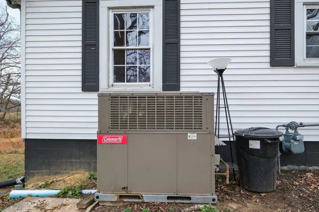 a view of a patio with table and chairs and potted plants
