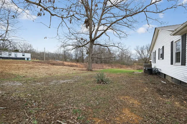 a view of a yard with a house