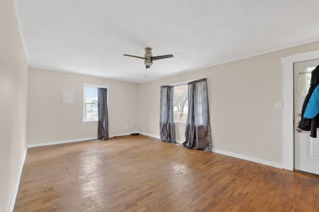 a view of an empty room with a window