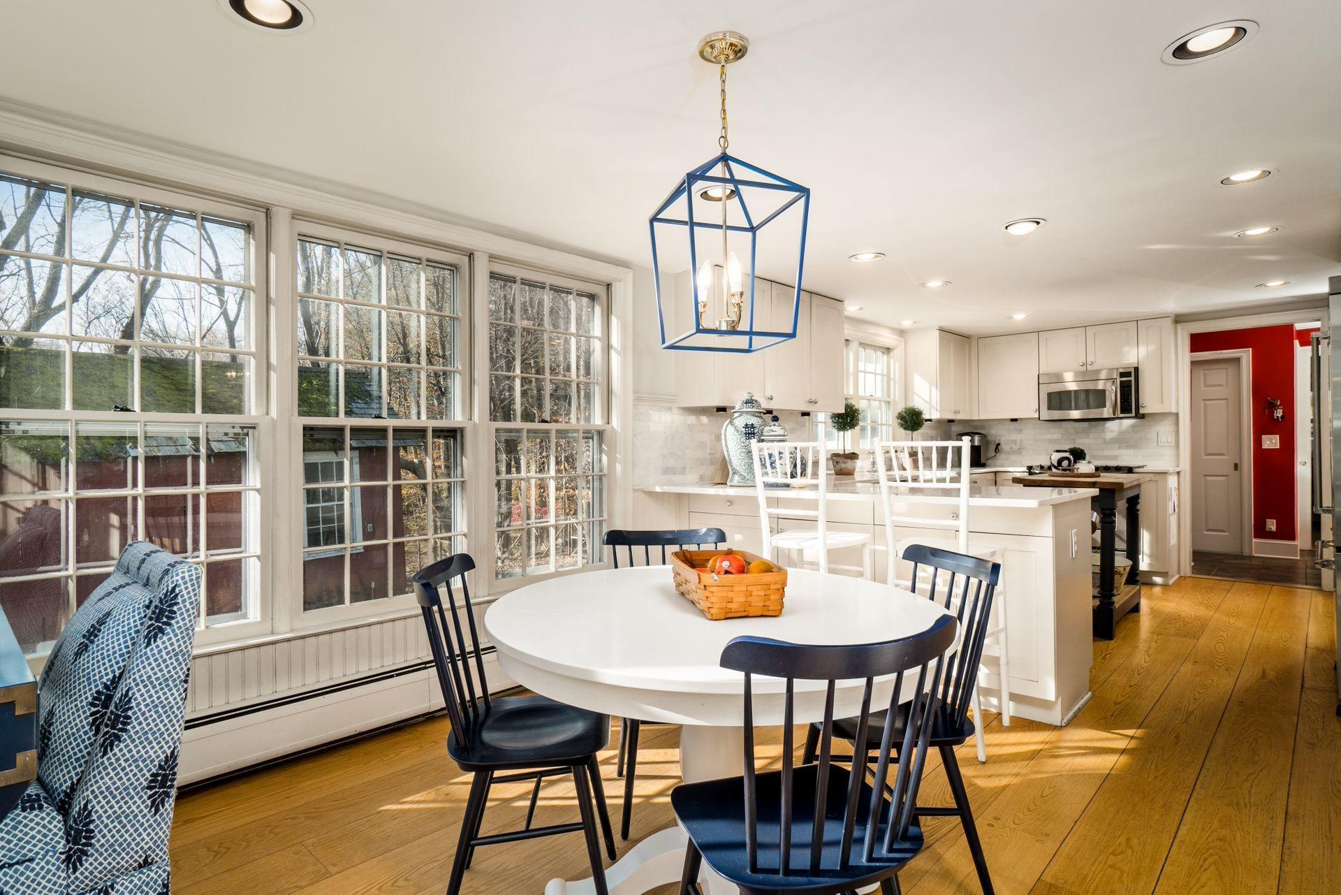 1122 Smith Ridge Road New Canaan, CT 06840 - Photo 9 of 25 a view of a dining room with furniture window and outside view