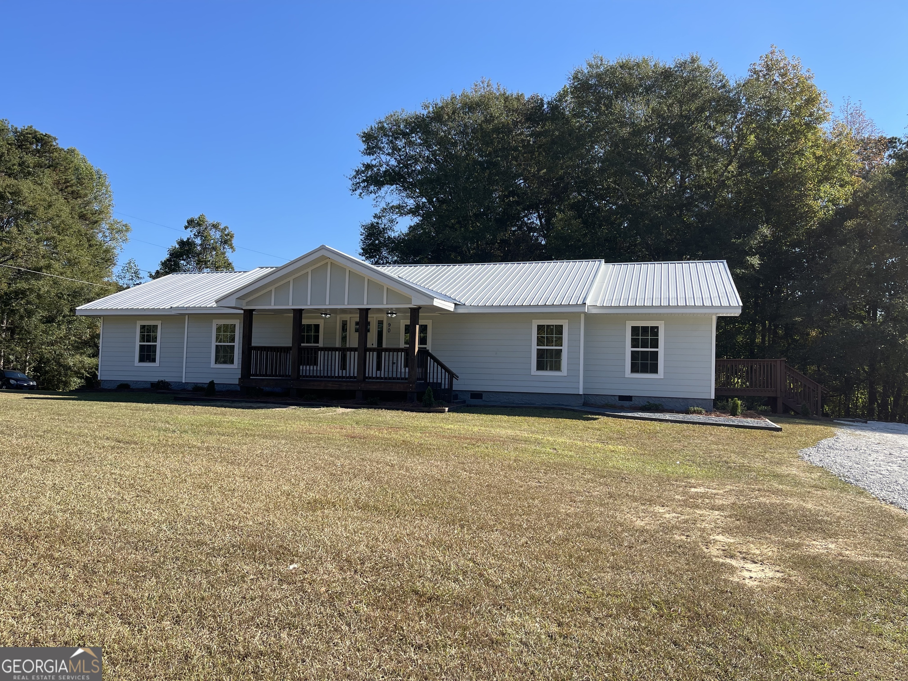90 Gammon Road Carrollton, GA 30117 - Photo 1 of 1 a front view of a house with yard and trees