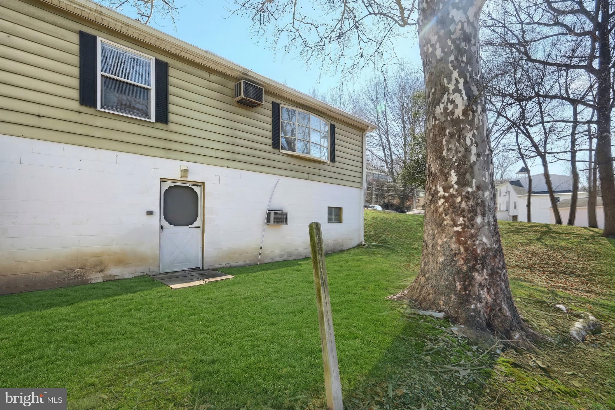 101 Tri Hill Road York, PA 17403 - Photo 8 of 34 Charming backyard retreat with lush greenery.