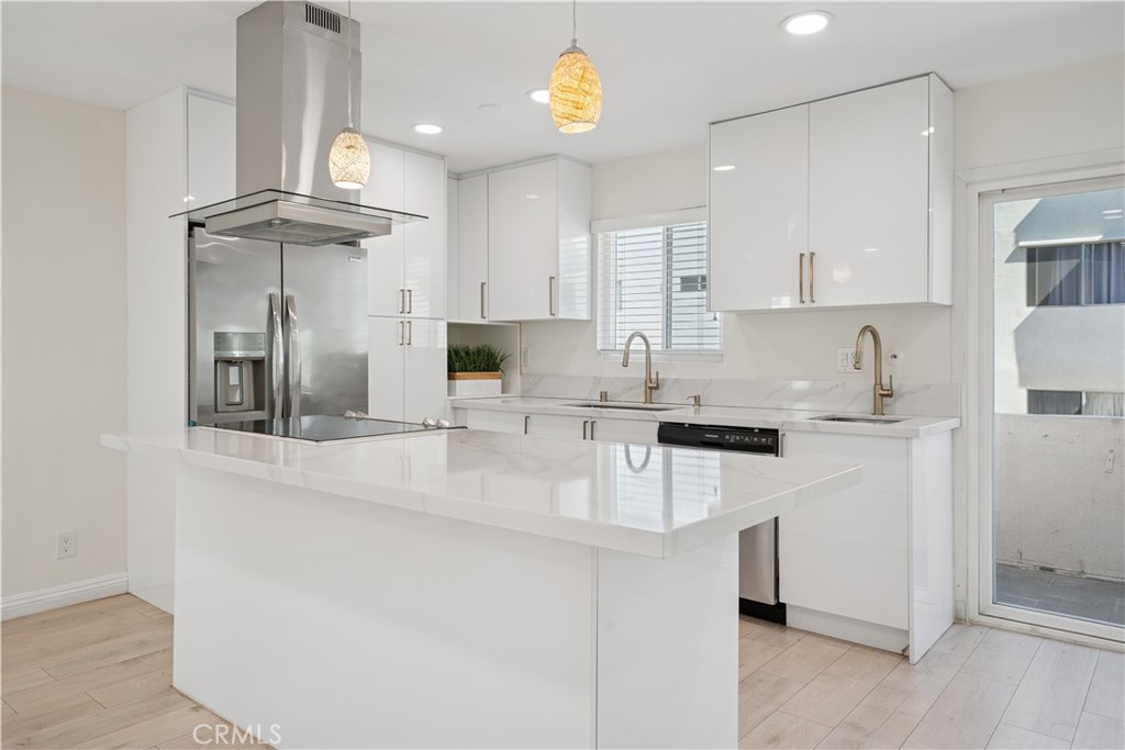 5330 Zelzah Avenue, Unit 7 Encino, CA 91316 - Photo 12 of 35 a kitchen with stainless steel appliances granite countertop a sink a stove and cabinets