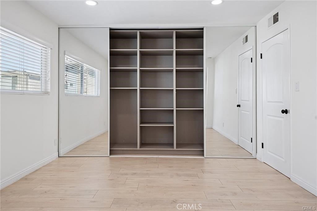 5330 Zelzah Avenue, Unit 7 Encino, CA 91316 - Photo 18 of 35 a view of an empty room with a window and closet