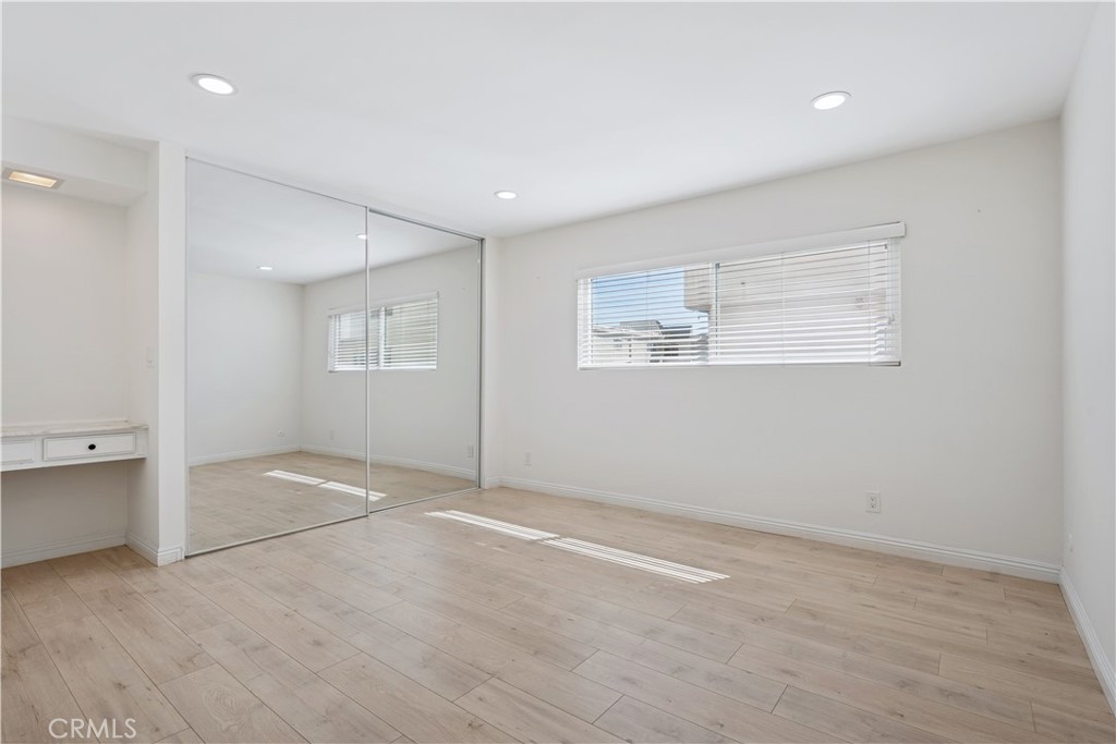 5330 Zelzah Avenue, Unit 7 Encino, CA 91316 - Photo 20 of 35 wooden floor in an empty room with a window