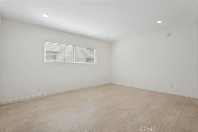 an empty room with a empty space and window