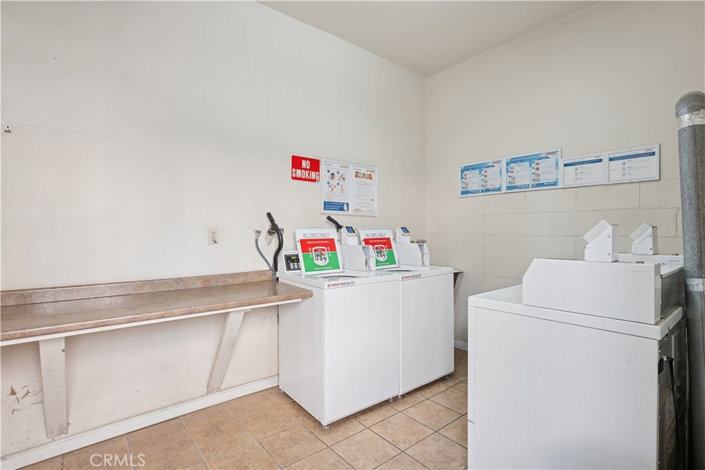5330 Zelzah Avenue, Unit 7 Encino, CA 91316 - Photo 33 of 35 a utility room with dryer and washer