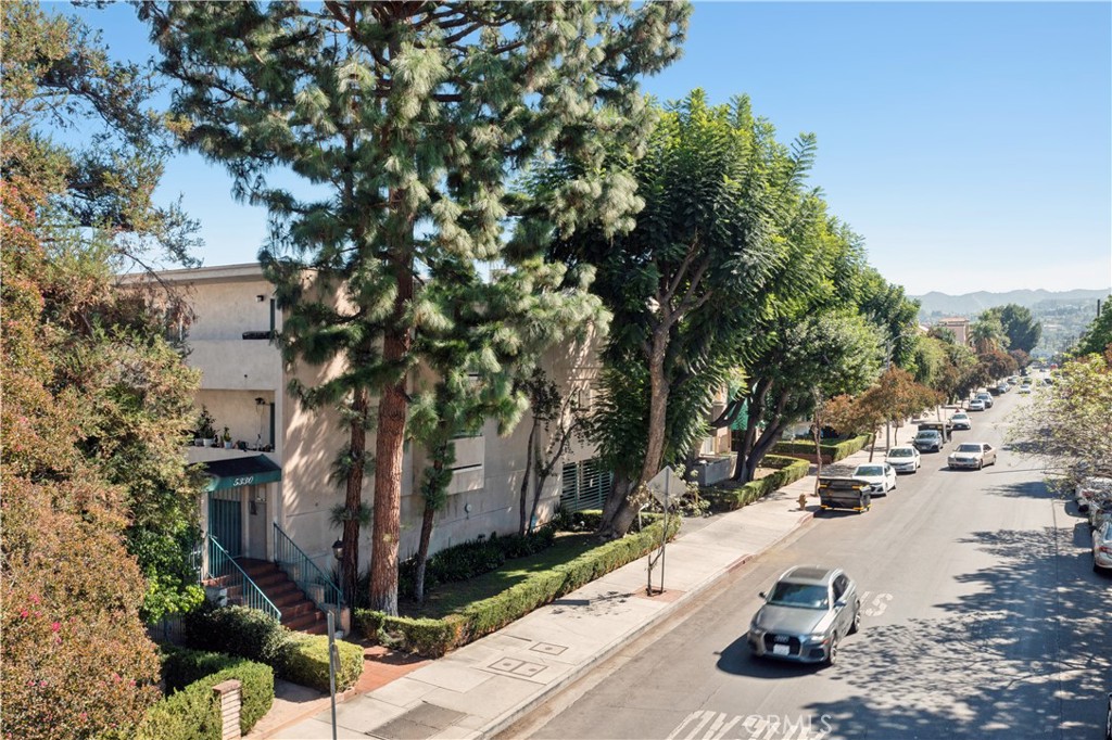 5330 Zelzah Avenue, Unit 7 Encino, CA 91316 - Photo 35 of 35 a view of a city with tall trees