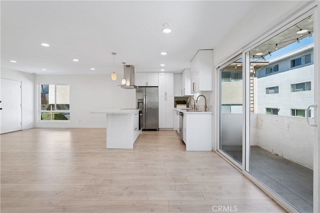 5330 Zelzah Avenue, Unit 7 Encino, CA 91316 - Photo 8 of 35 a view of a kitchen with refrigerator and a stove top oven