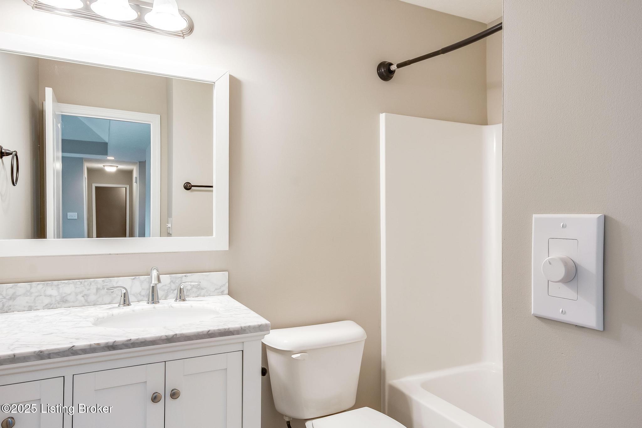 204 Autumn Ridge Drive Mount Washington, KY 40047 - Photo 22 of 61 2nd Full Bath located by Bedrooms #2 and #3 with ceramic tile flooring, new toilet, new vanity w/pullout drawers & storage shelf, new light fixture, new exhaust fan, shower/tub and surround sound speaker w/volume control knob.
