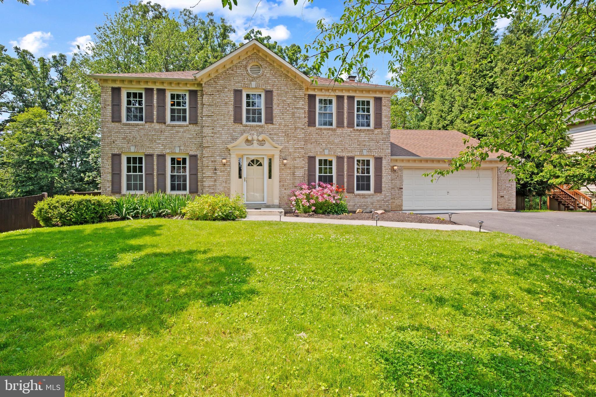 15016 Wellwood Road Silver Spring, MD 20905 - Photo 1 of 52 a front view of a house with garden