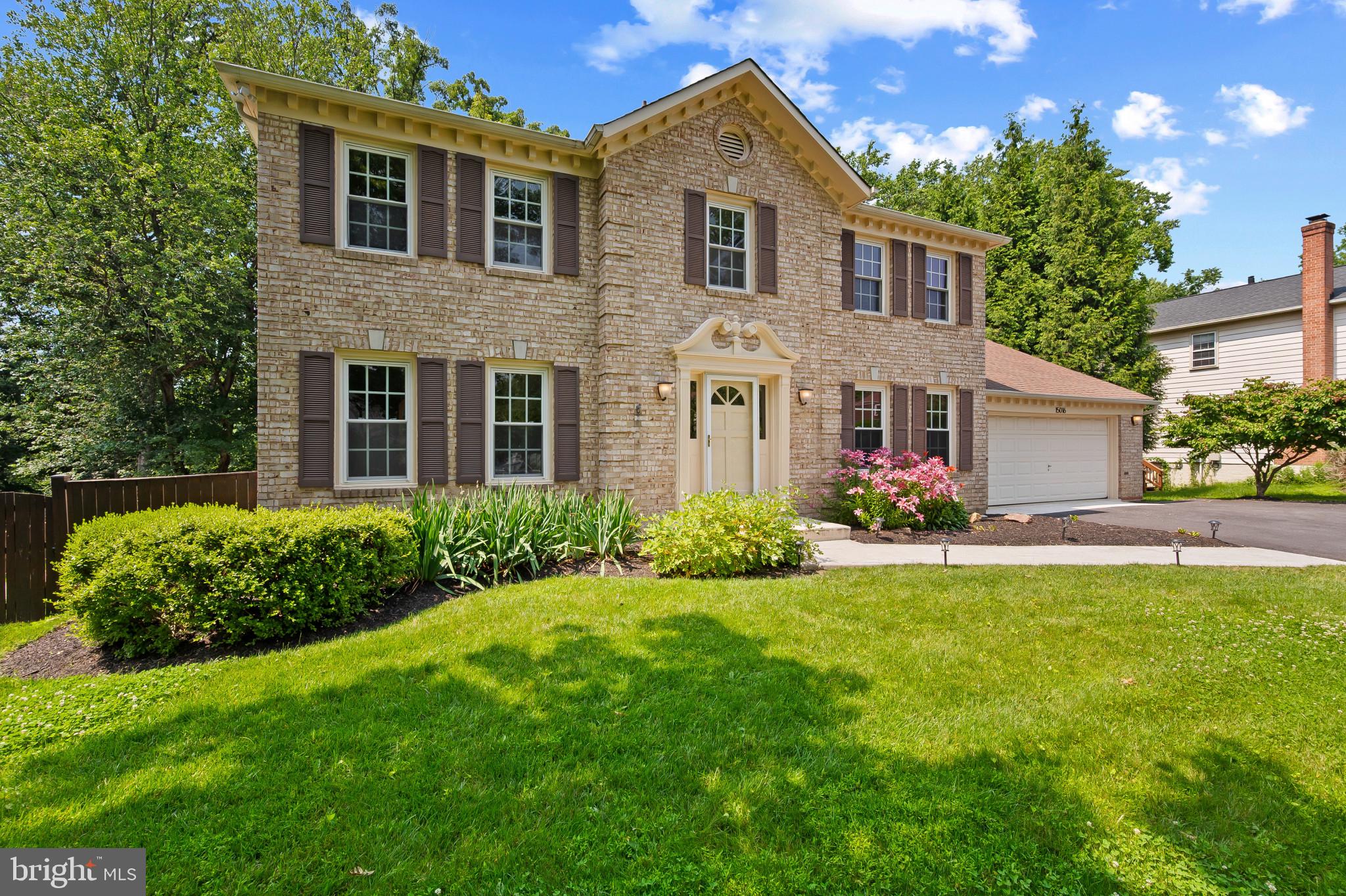 15016 Wellwood Road Silver Spring, MD 20905 - Photo 2 of 52 a front view of a house with garden