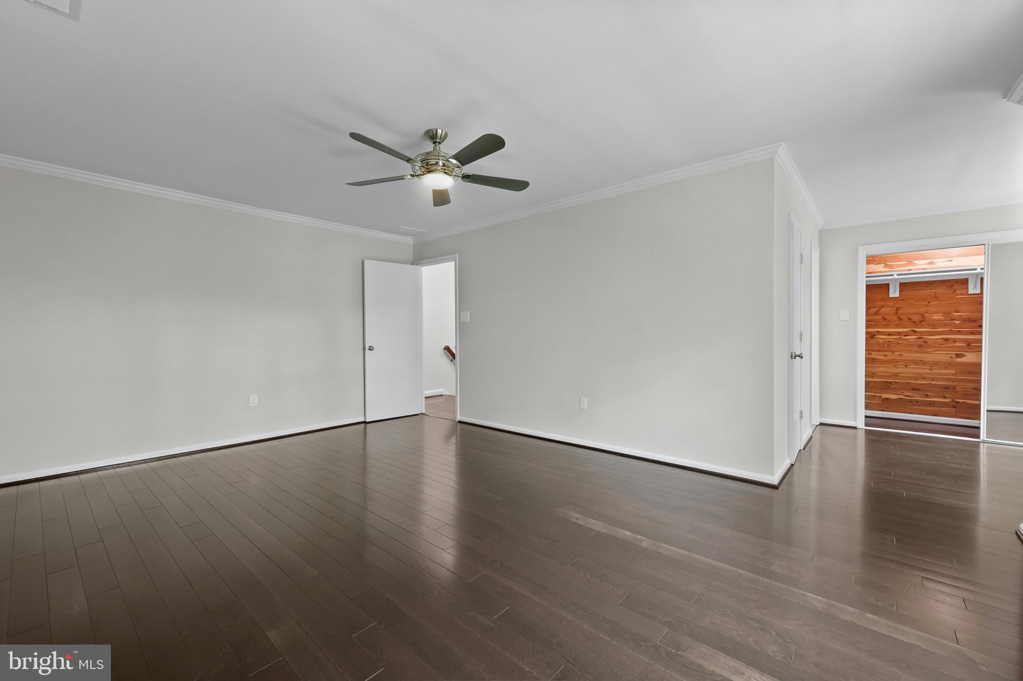 15016 Wellwood Road Silver Spring, MD 20905 - Photo 23 of 52 an empty room with wooden floor and window