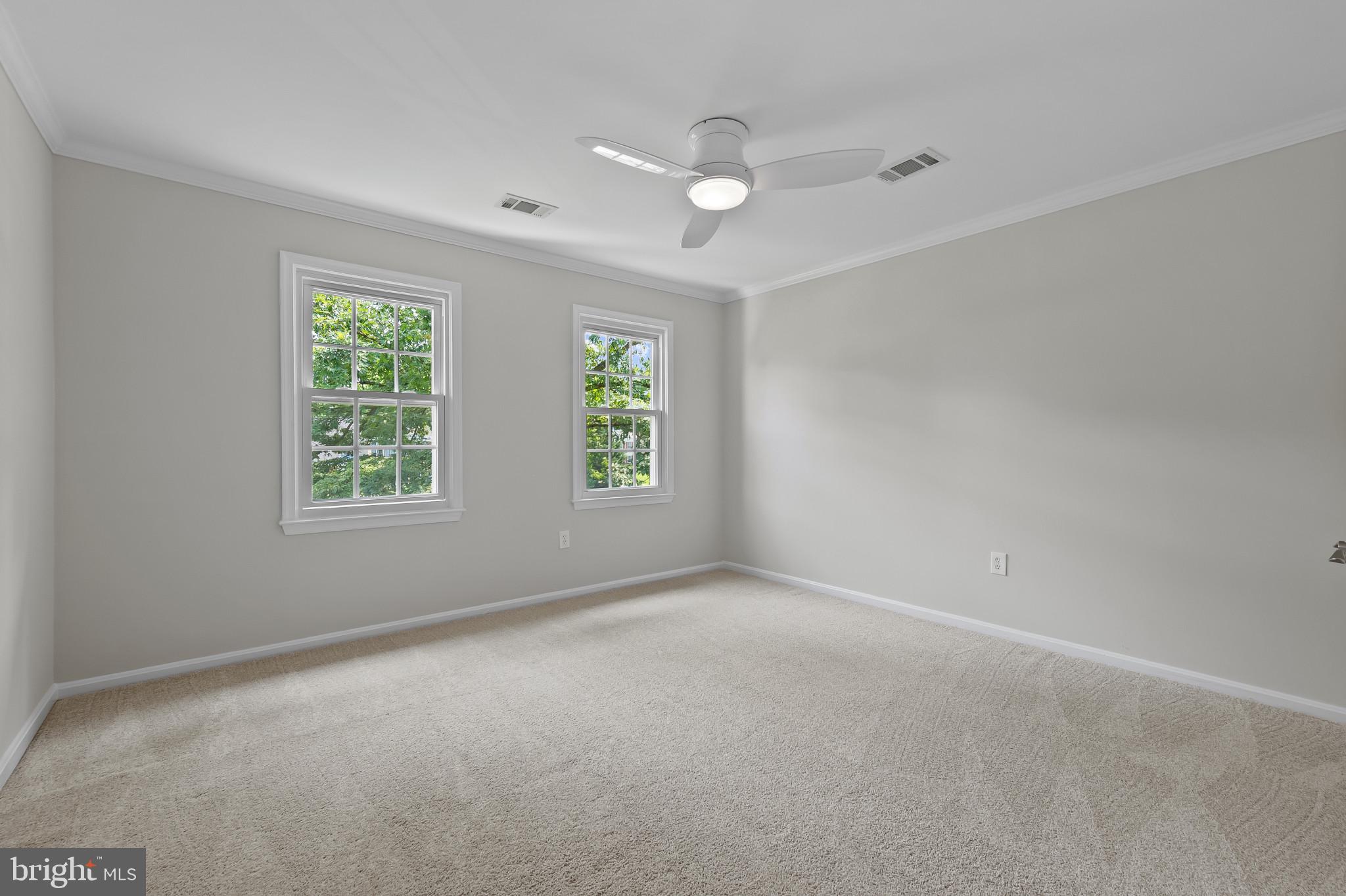 15016 Wellwood Road Silver Spring, MD 20905 - Photo 28 of 52 an empty room with windows