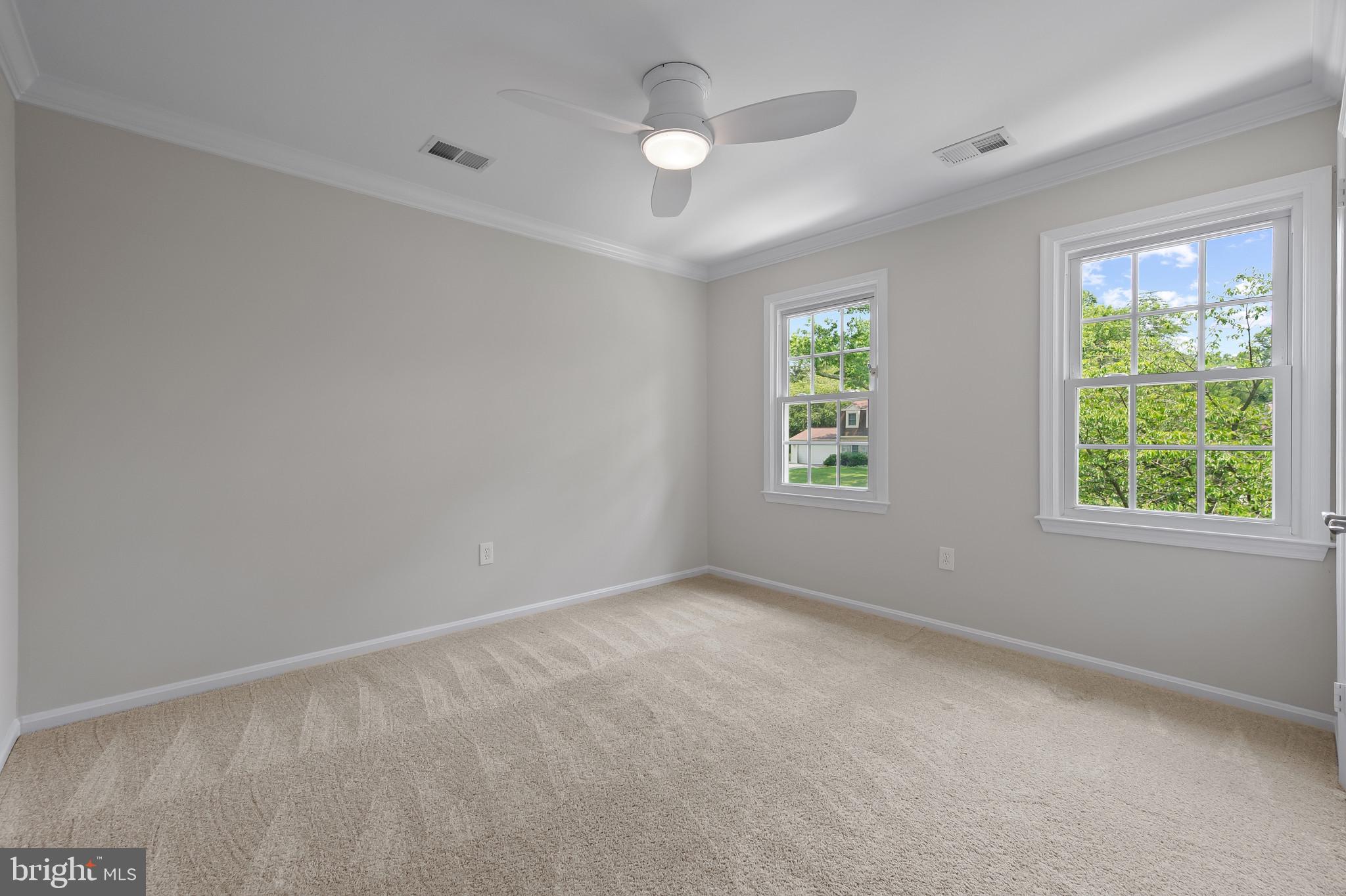15016 Wellwood Road Silver Spring, MD 20905 - Photo 30 of 52 an empty room with windows