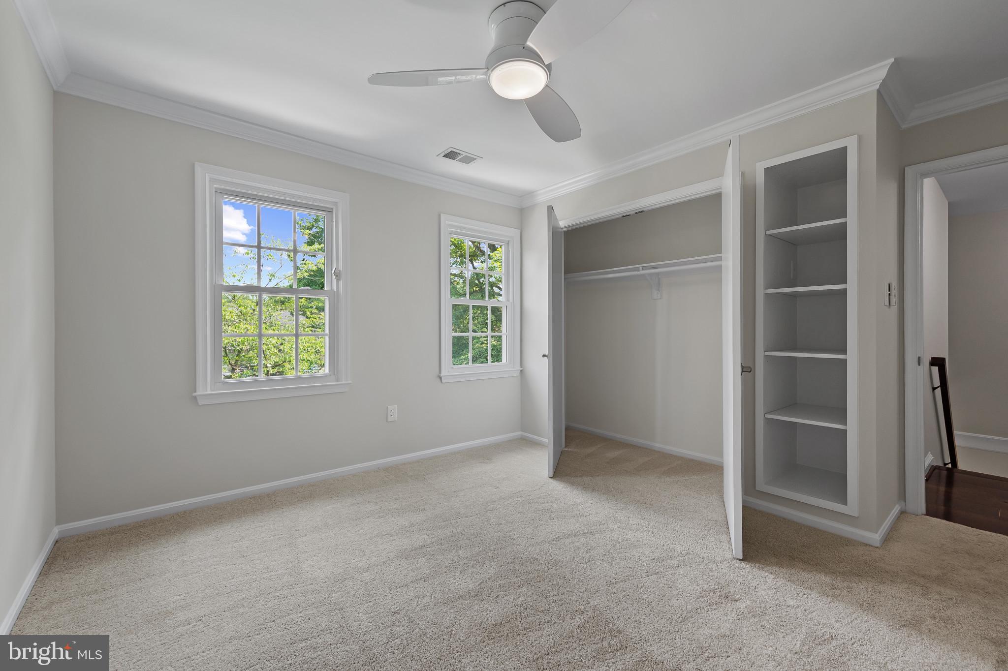 15016 Wellwood Road Silver Spring, MD 20905 - Photo 31 of 52 an empty room with windows and closet