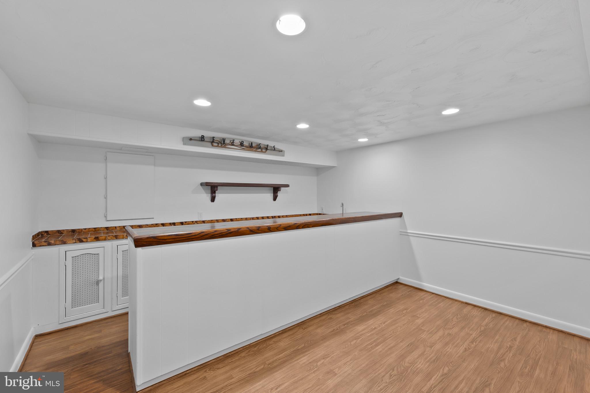15016 Wellwood Road Silver Spring, MD 20905 - Photo 37 of 52 a view of a room with wooden floor
