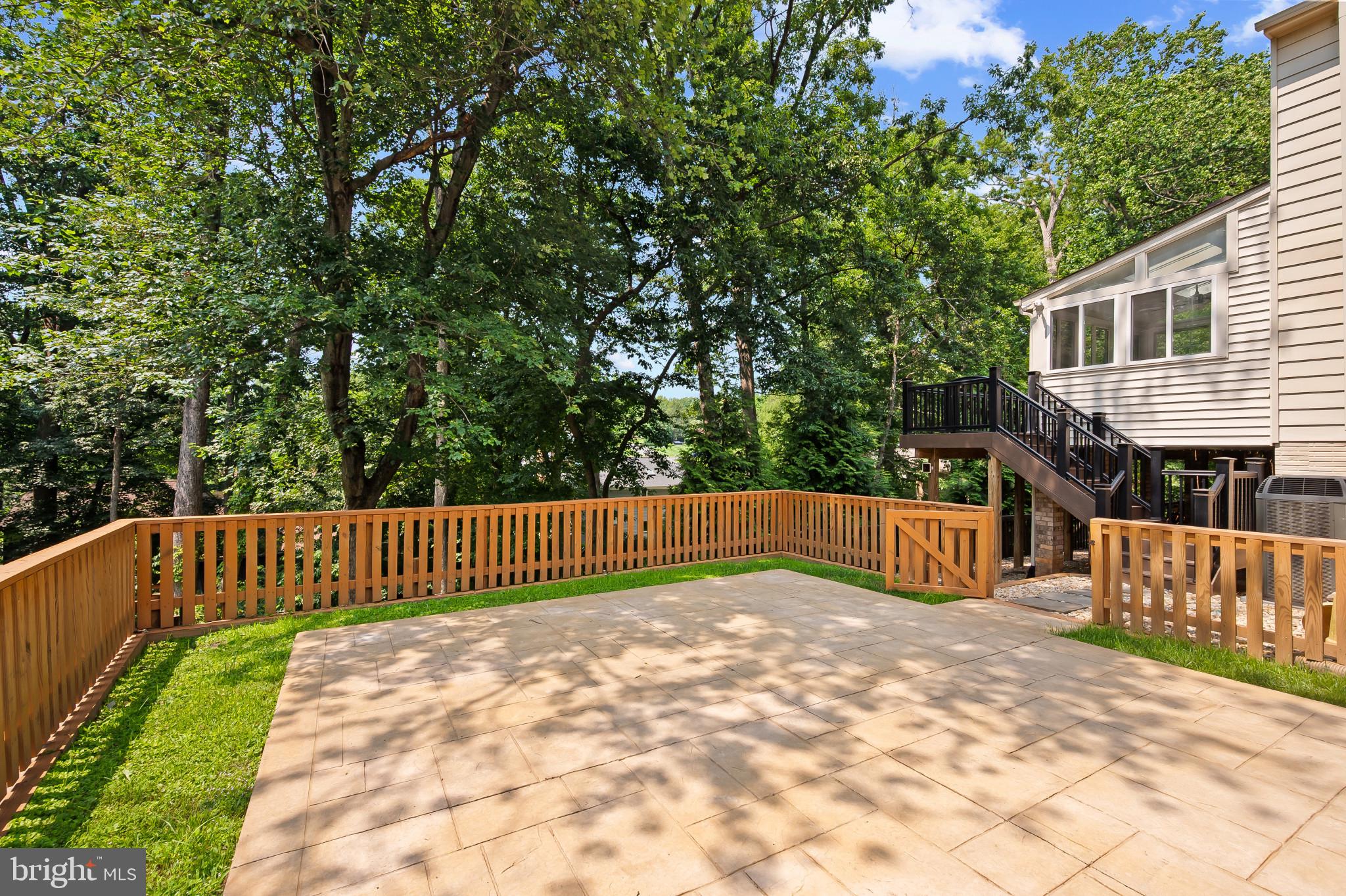 15016 Wellwood Road Silver Spring, MD 20905 - Photo 42 of 52 a view of balcony with wooden fence and trees