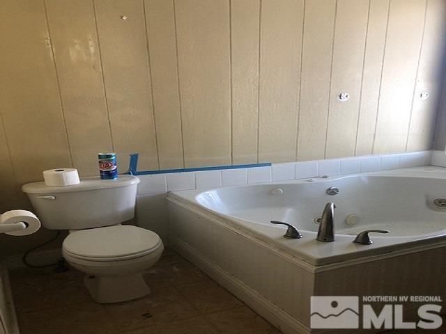 490 Capricorn Circle Reno, NV 89521 - Photo 14 of 26 a bathroom with a sink a toilet and a mirror