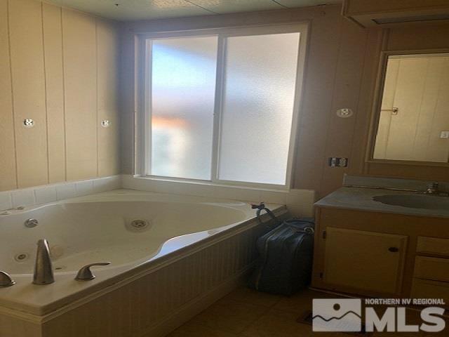 490 Capricorn Circle Reno, NV 89521 - Photo 15 of 26 a bathroom with a tub and a sink