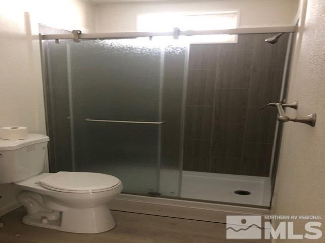 490 Capricorn Circle Reno, NV 89521 - Photo 23 of 26 a bathroom with a shower and a toilet