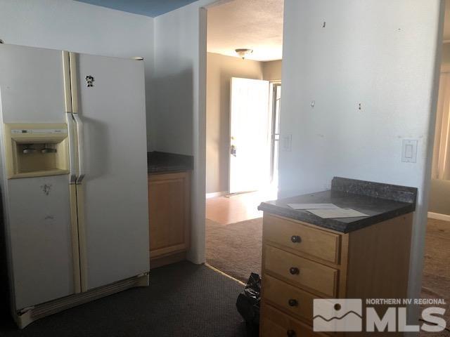 490 Capricorn Circle Reno, NV 89521 - Photo 7 of 26 a bathroom with a granite countertop sink and a mirror