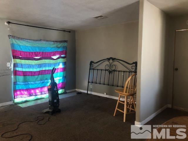 490 Capricorn Circle Reno, NV 89521 - Photo 8 of 26 a bedroom with a bed and a window