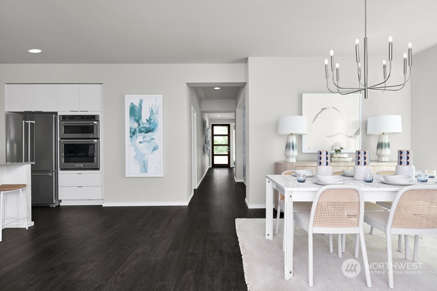 5661 Great Gln Road Southwest Port Orchard, WA 98367 - Photo 4 of 10 a view of a dining room with furniture window and wooden floor