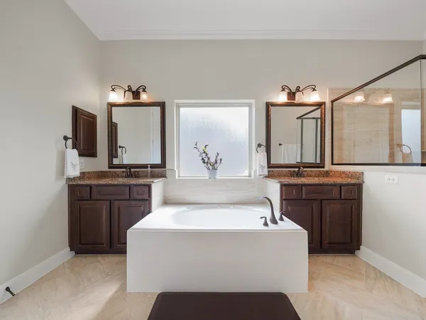 a living room with a sink and dishwasher with kitchen island