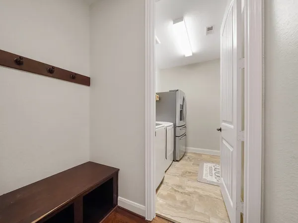 a view of a bathroom with a sink and a mirror