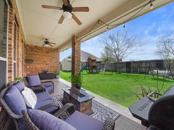 a outdoor living space with patio furniture and a garden