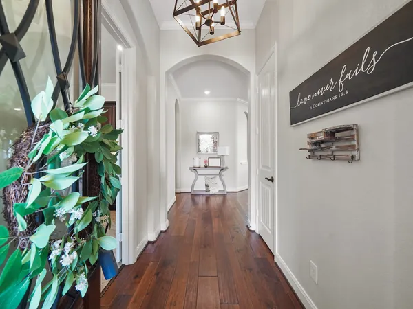 a view of a hallway view with wooden floor
