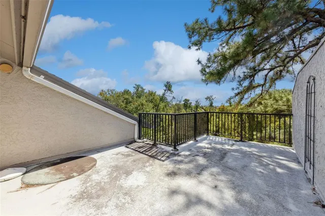 an aerial view of a house with a lake view