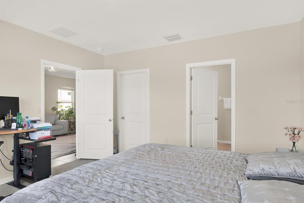 16034 Tuscany Hillside Road Odessa, FL 33556 - Photo 18 of 48 a bedroom with a bed and furniture