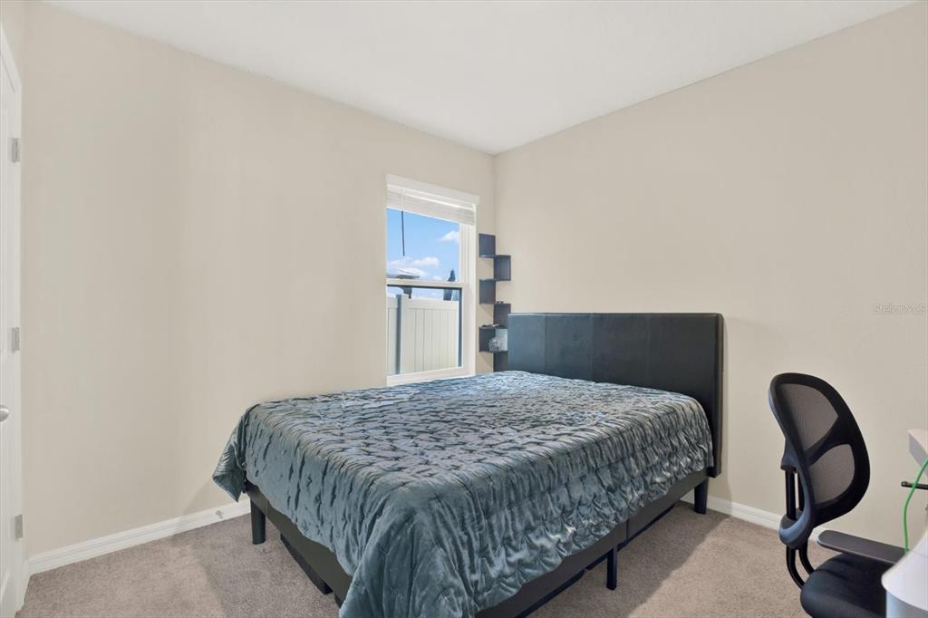 16034 Tuscany Hillside Road Odessa, FL 33556 - Photo 23 of 48 a bedroom with a bed and dresser