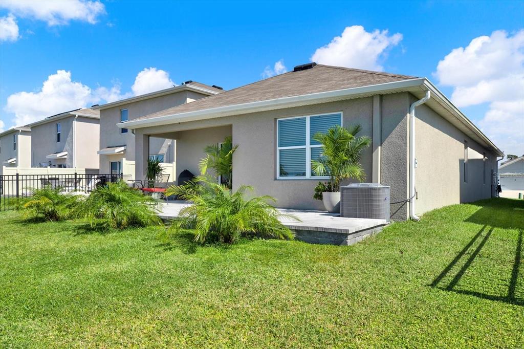 16034 Tuscany Hillside Road Odessa, FL 33556 - Photo 26 of 48 a front view of a house with a yard